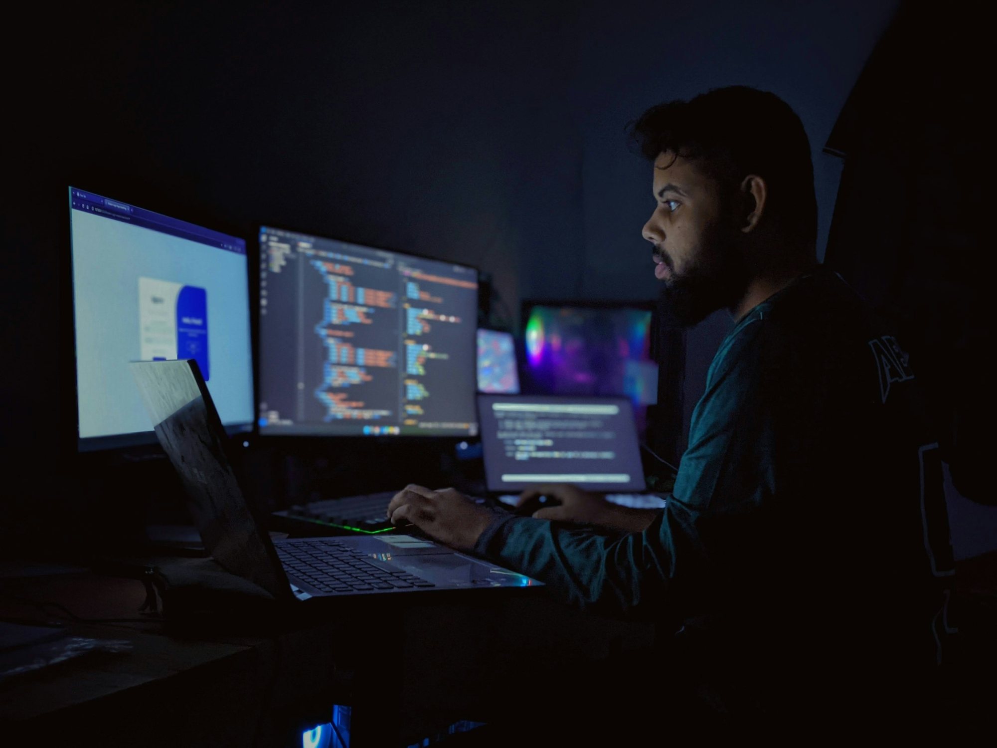 Engineer monitoring traffic on three screens